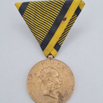 Kriegsmedaille 1873 mit Walzenöse am Band